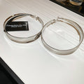 Wide Polished Hoop Earrings In Gold And Silver With Decorative Details view 7