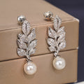Silver Tone Crystal Leaf Earrings with Pearl Drop Accents view 3