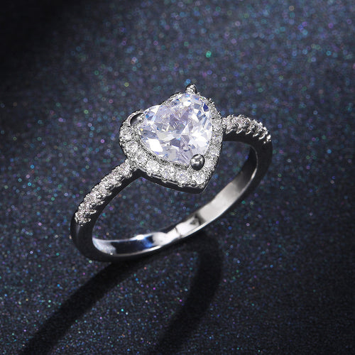 Silver-tone ring with clear heart center and halo