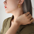 Twisted C-Shape Stud Hoop Earrings Gold Steel Tone Pair view 1