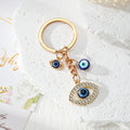 Gold Tone Blue Evil Eye Charm Keychains in Eight Designs view 3