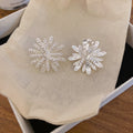 Radiating Textured Flower Clip On Earrings In Two Tones view 6