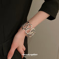 Spiral Disk And Organic Loop Open Cuffs In Gold Or Silver Tone view 2