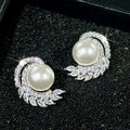 Silver Tone Faux Pearl Stud Earrings with Leaf CZ Accents view 1