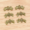 Ribbon Bow Charms in Silver and Antique Bronze Tones view 2