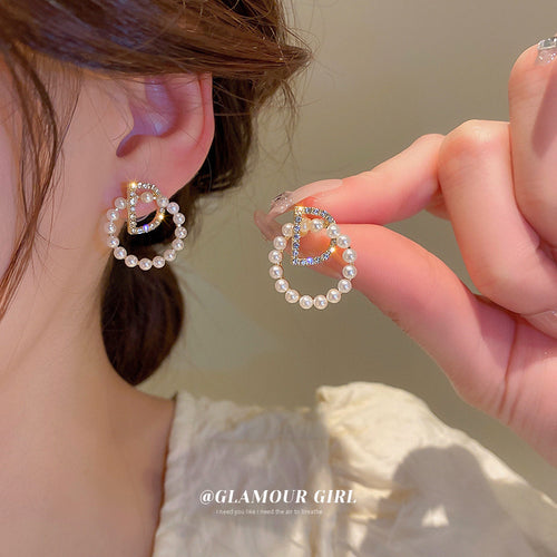 Pearl Trim Letter D Gold Tone Statement Hoop Stud Earrings shown in arranged product view