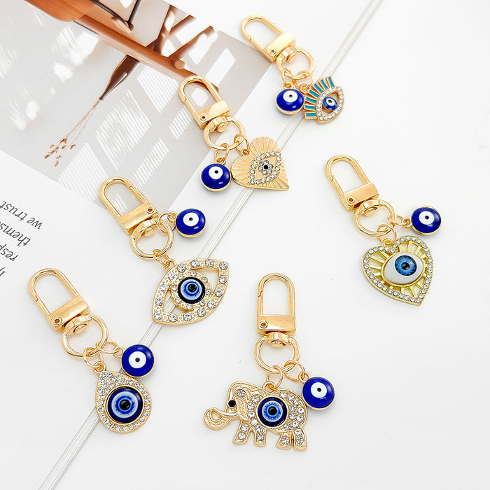 Gold-Tone Evil Eye Bead Keychain With Rhinestone Hamsa Charm