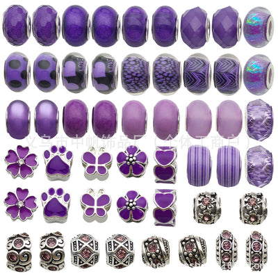 Purple assorted shape beads arranged on a light background