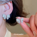 Crystal Bow Stud Earrings in Gold and Silver Tones view 4