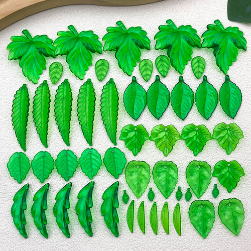Clear leaf beads arranged on a light background