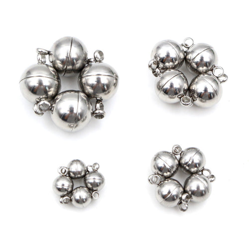 Round Stainless Steel Magnetic Jewelry Clasps in Four Sizes, grouped overview on a plain background