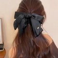 Black Satin Oversized Bow Hair Claw Clip with Gold Charm view 6