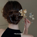 Gold Tone Flower Hair Pin With Textured Petals And Hanging Leaves view 4