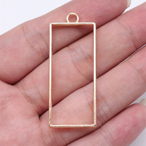 Tall Rectangle Open Frame Pendants in Four Metal Finishes shown in image 1, highlighting a slim open rectangle, flat wir