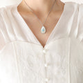 Teardrop White Shell Pendant Necklace Blue Center Stone view 6