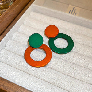 Floral Crystal Threader Earrings and Geometric Disc Earrings shown in a styled or display view