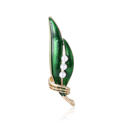 Green enamel leaf brooch three white pearls gold stem on white