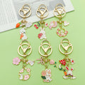 Easter Bunny Charm Keychains Featuring Pink Blossom Across 19 Pictured Variations view 4