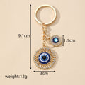 Gold and Silver Tone Openwork Heart and Round Evil Eye Keychains view 4
