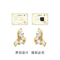 Gold-Tone Ribbon Wrap Clear Crystal Baguette Stud Earrings view 3