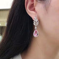 Pink Teardrop Crystal Wing Drop Earrings With Clear Stone Accents view 4