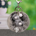 Pearl Wire Flower Pom Pom Keychains in Fifteen Pictured Colors view 9