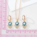 Gold Tone Crystal Hamsa Evil Eye Necklace and Huggie Earrings view 4