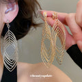 Layered Open Leaf Ear Clips in Gold and Silver Tone Finishes view 1