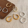 Round Huggie Hoop Earrings In Gold Silver Polished And Matte view 3