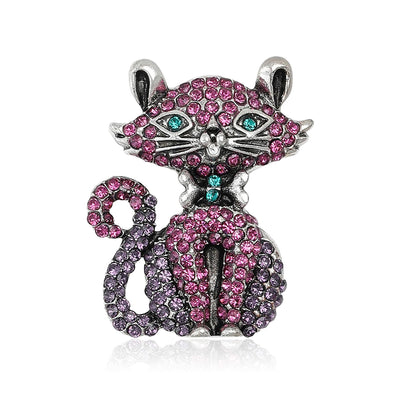 Front view of purple crystal cat brooch with curled tail decorative metal pin