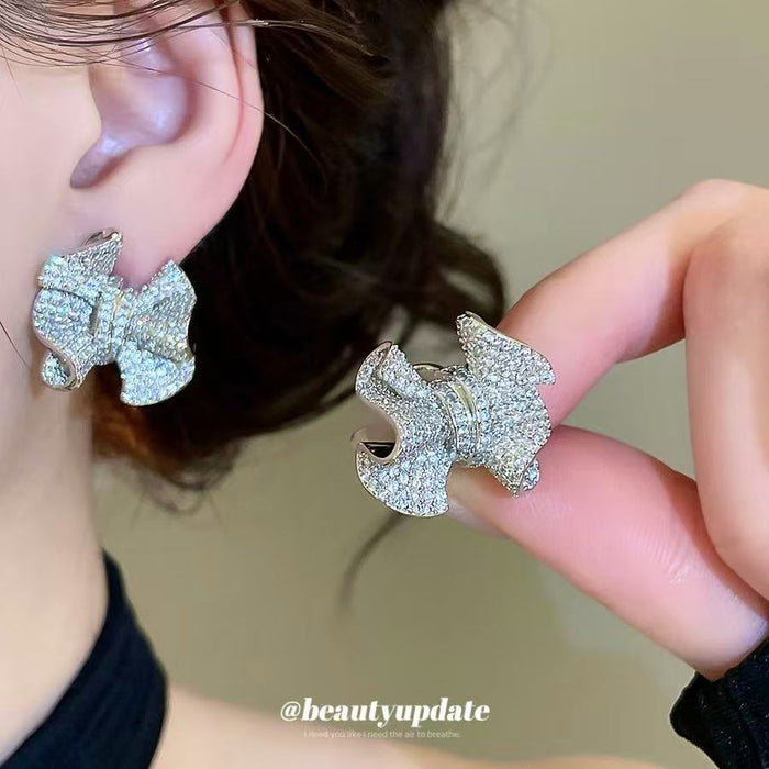 Silver Tone Crystal Crinkle Bow Statement Stud Earrings