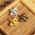 Small Striped Bee Metal Charm in Four Vintage Finishes view 1