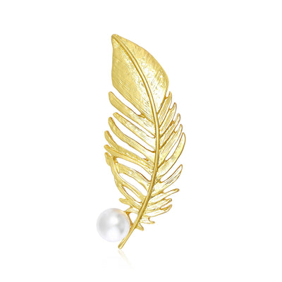Front view of an open textured feather ending beside a single round pearl
