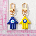 Gold Tone Colorful Hamsa Evil Eye Clip Keychains in Nine Colors view 4