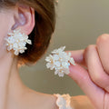 White Floral Pearl Stud and Hoop Earrings in Fourteen Styles view 9