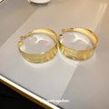 Wide Textured Hoop Earrings in Gold and Silver Tones view 3