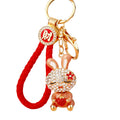 Jeweled Strawberry Holding Rabbit Keychains in Four Pictured Colors view 5