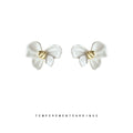 White Enamel Bow Stud Earrings With Gold Center Knot view 1