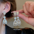 Crystal Teardrop Statement Earrings in Gold and Silver Tones view 2