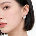 Silver Liquid Flower Stud Earrings Purple Center Crystal view 2