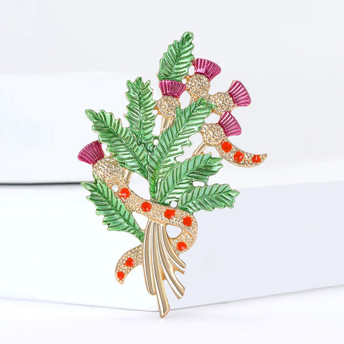Angled product view of 彩色蓟花束胸针 showing surface color and shine
