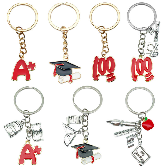 Graduation Charm Keychains Featuring Cap And Tools Across 31 Pictured Variations