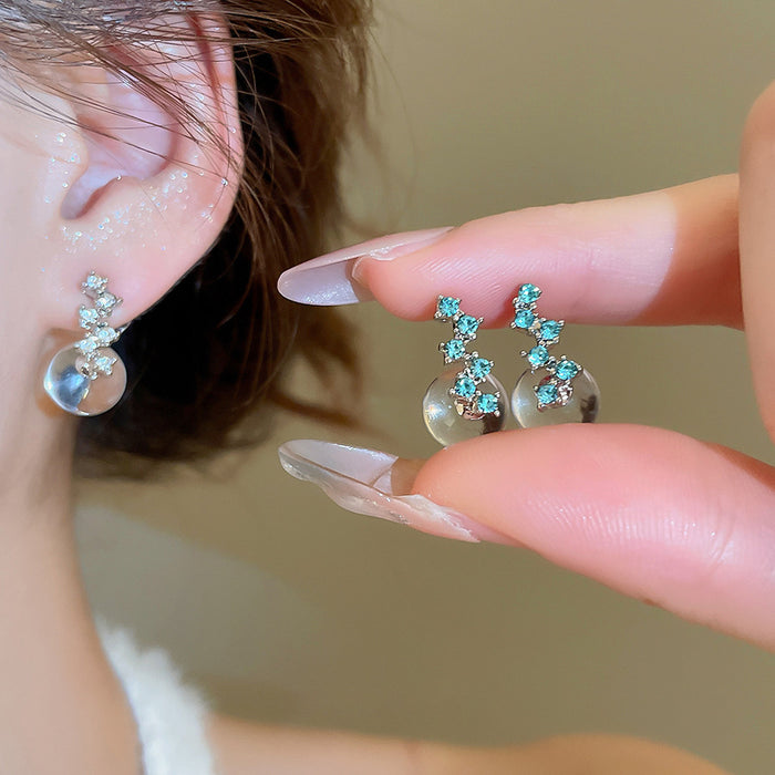 Blue Crystal Moon Pearl Drop Earrings with Distinctive Textured Details