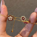 Gold Tone Flower Chain Bracelet Red Crystal Centers view 4