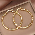 Gold Tone Twisted Wavy Thin Hoop Latch Back Earrings view 2