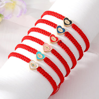 Main product view of red Woven Cord Small Heart Evil Eye Adjustable Bracelets
