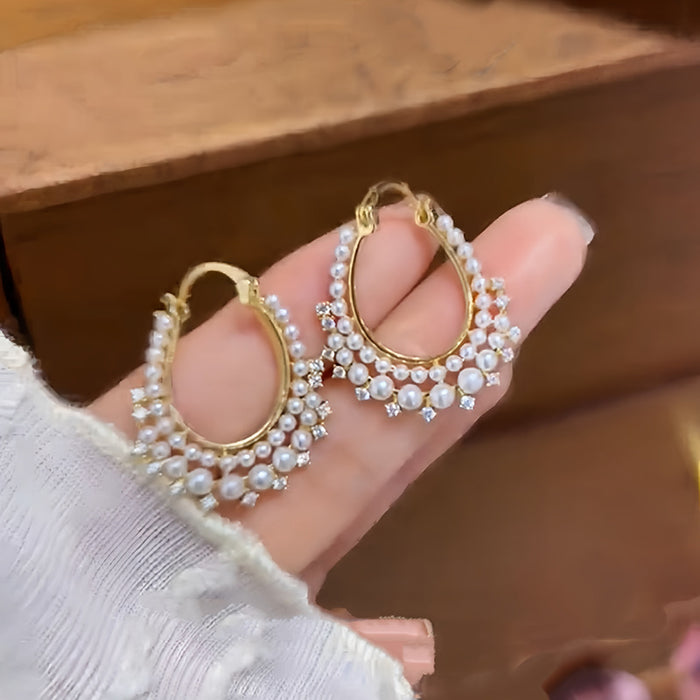 Gold Tone Twisted Hoop Earrings With Crystal Pearl Rows