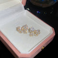 Crystal Bow Stud Earrings in Silver and Gold with Polished Metal Details view 6
