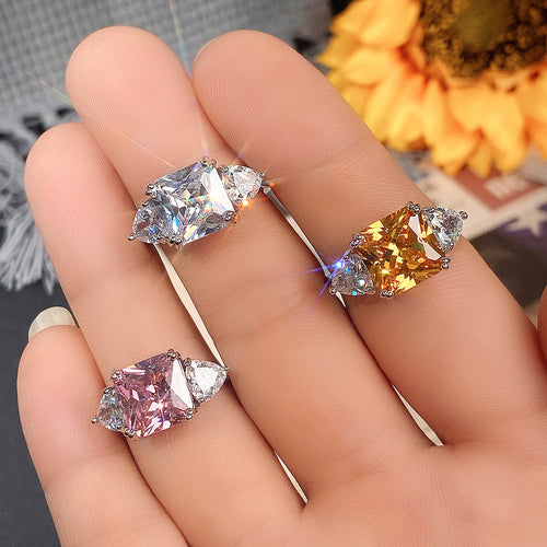 Styled view showing pink, clear, and golden oval center options with clear halos