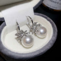 Silver Crystal and Pearl Huggie Earrings with Floral Accents view 6
